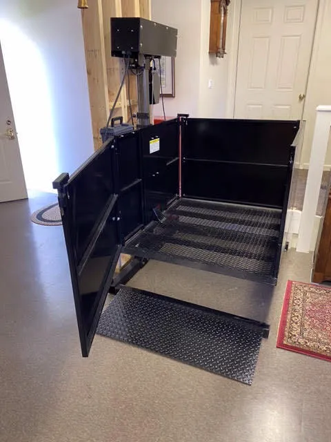 Residential lift connecting a driveway and porch
