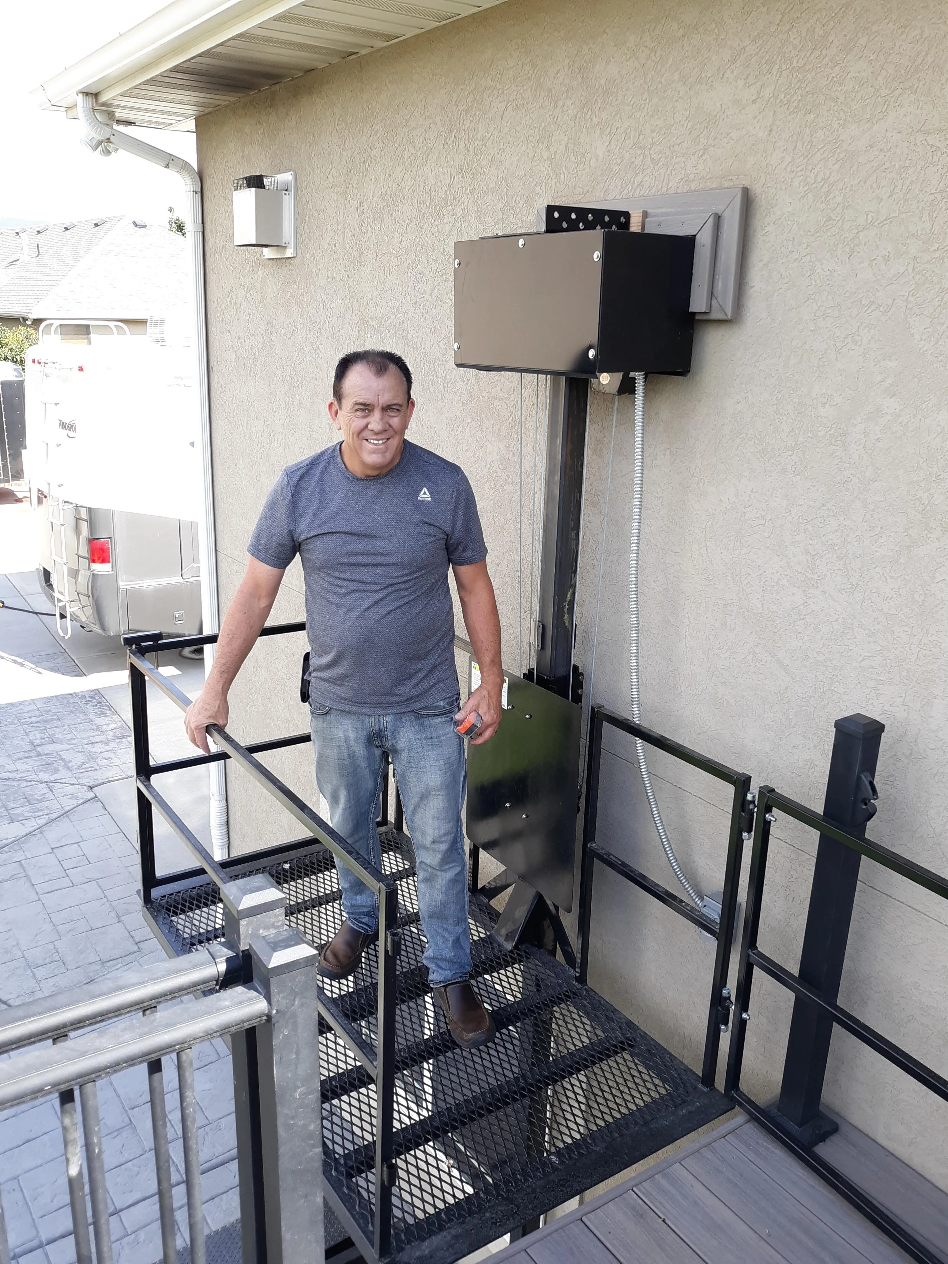 Low-rise platform lift with full landing and gate visible