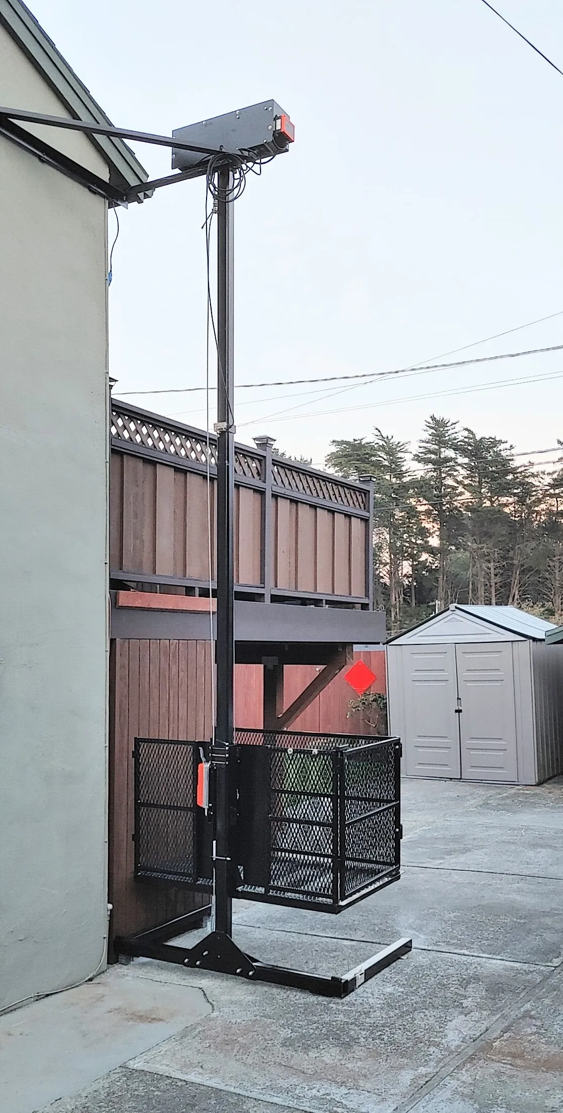 Outdoor lift installation in a compact side yard